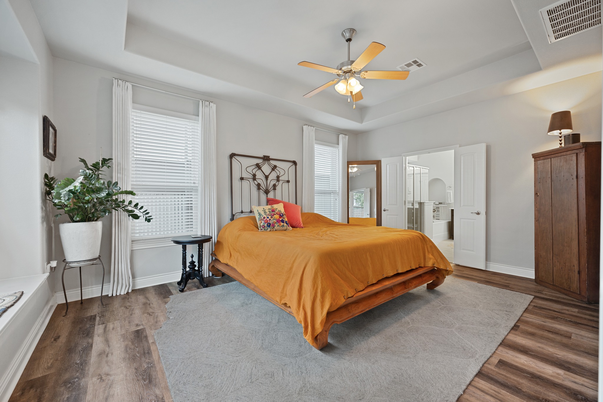 6405 Alleyton Drive Austin, TX 78721 - Photo 9 of 30 a bed sitting in a spacious bedroom next to a window
