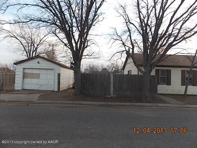 4101 South Travis Street Amarillo, TX 79110 - Photo 2 of 14 a front view of a house with trees and trees