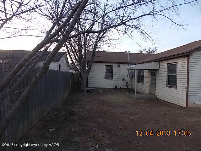 4101 South Travis Street Amarillo, TX 79110 - Photo 3 of 14 a view of a house with a yard