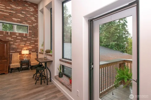 a view of a two chairs in the balcony