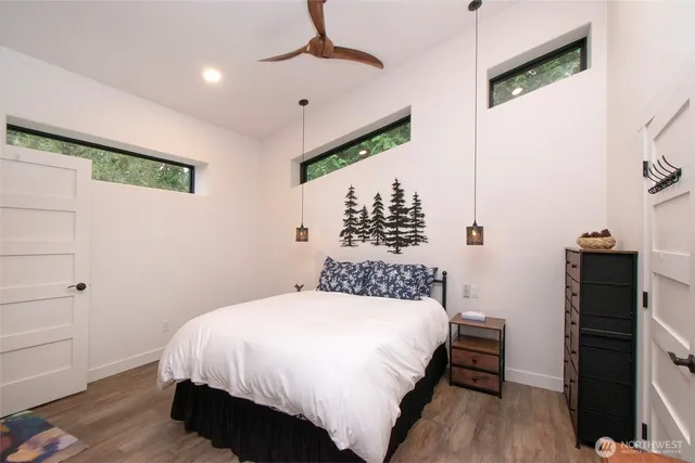 a bedroom with a bed and a dresser