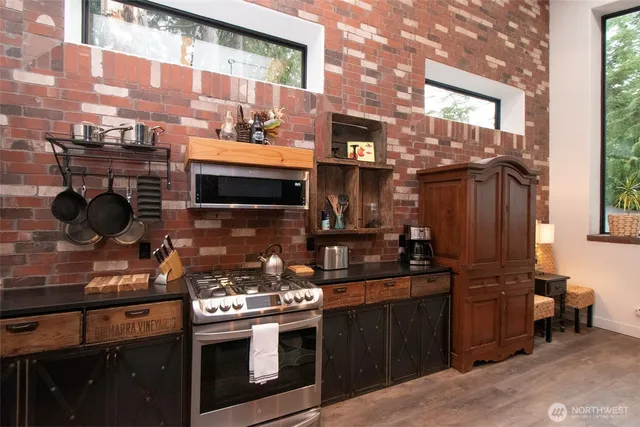 a kitchen with a stove and a microwave