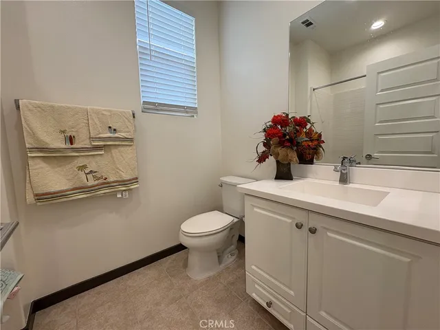 a bathroom with a sink toilet and vanity