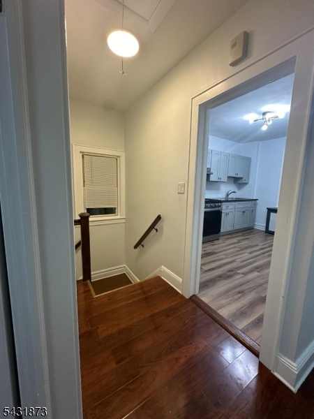 32 Hamilton Avenue, Unit 2 Fairview, NJ 07022 - Photo 25 of 30 a view of empty room with wooden floor
