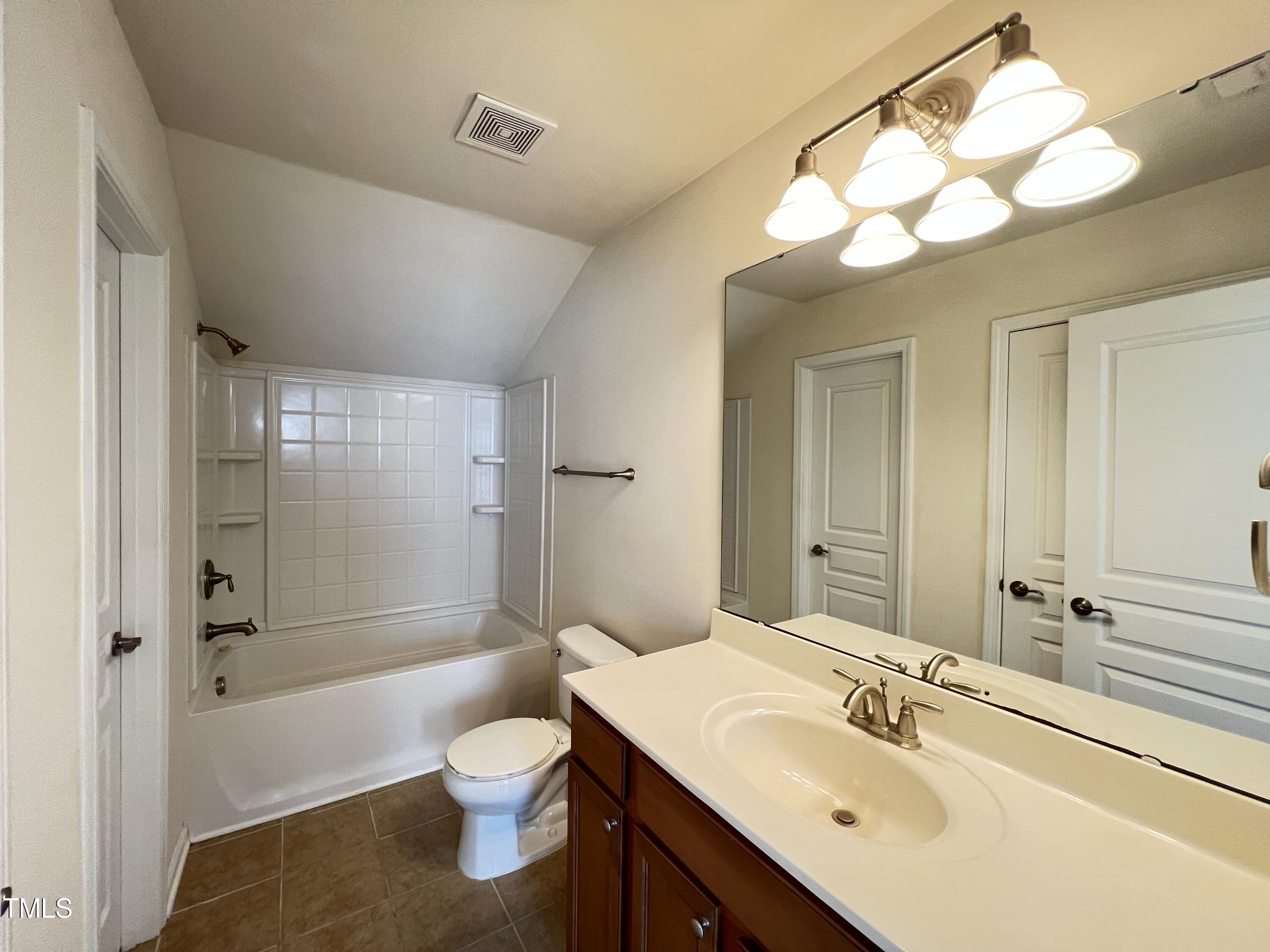 2919 Berkeley Springs Place Raleigh, NC 27616 - Photo 12 of 12 a bathroom with a sink a toilet and shower