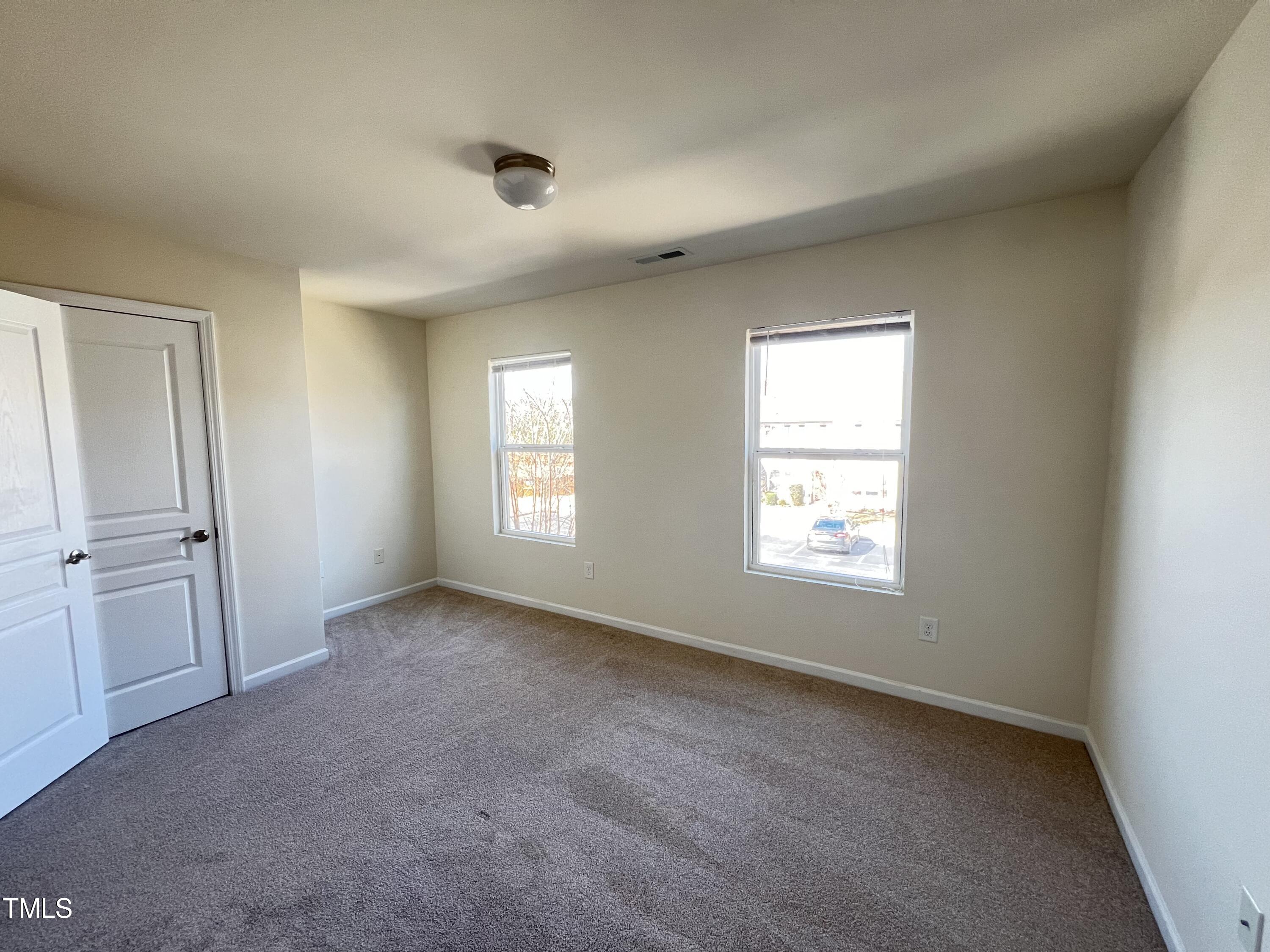 2919 Berkeley Springs Place Raleigh, NC 27616 - Photo 9 of 12 a view of an empty room with a window