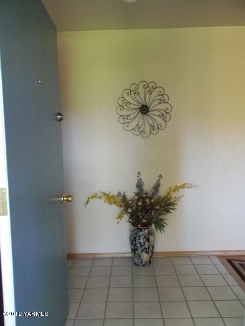 991 Olmstead Road Grandview, WA 98930 - Photo 7 of 17 a view of a potted plant sitting on a floor