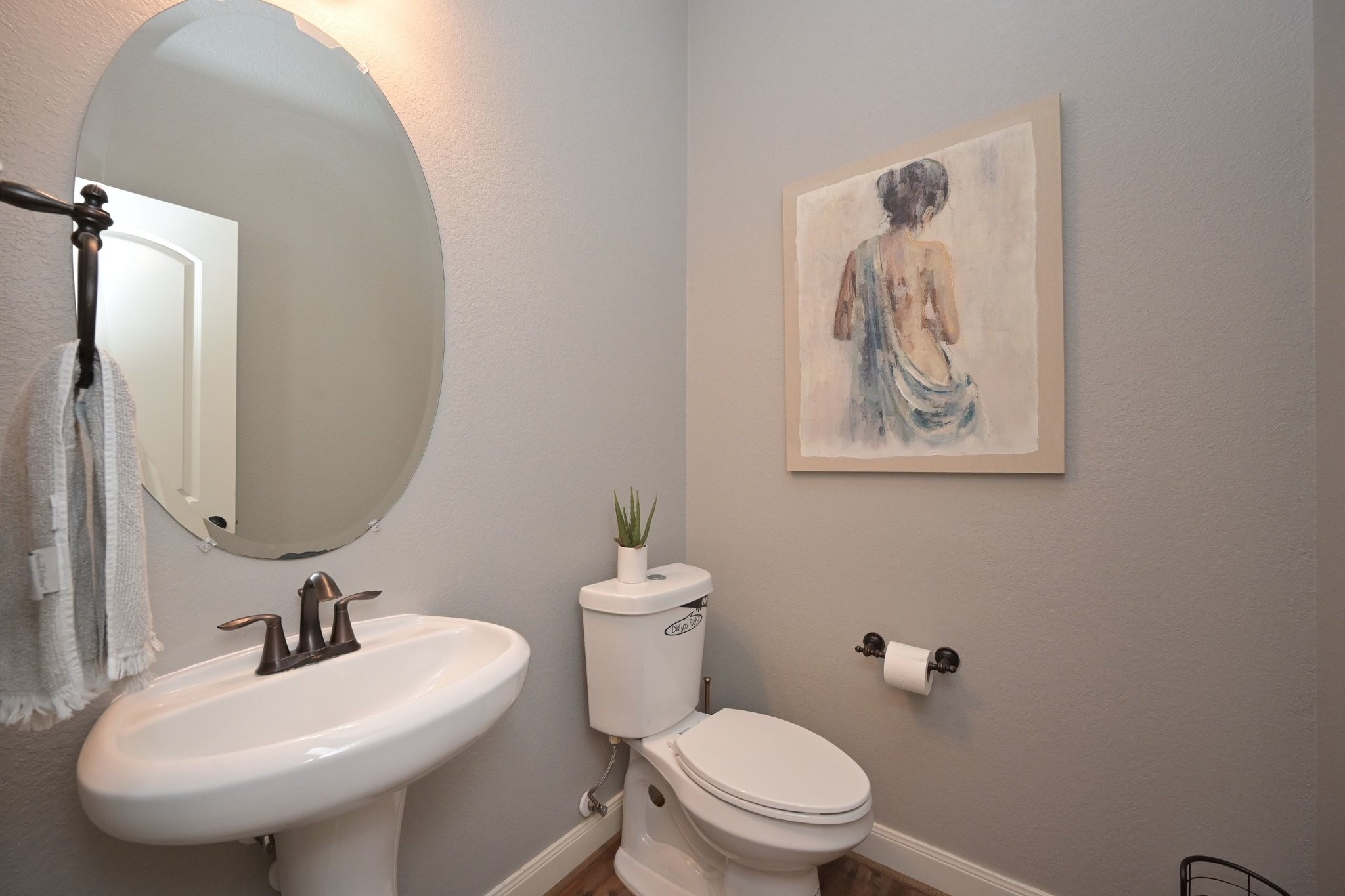11 South Victoriana Circle Spring, TX 77389 - Photo 9 of 38 a bathroom with a toilet sink and mirror