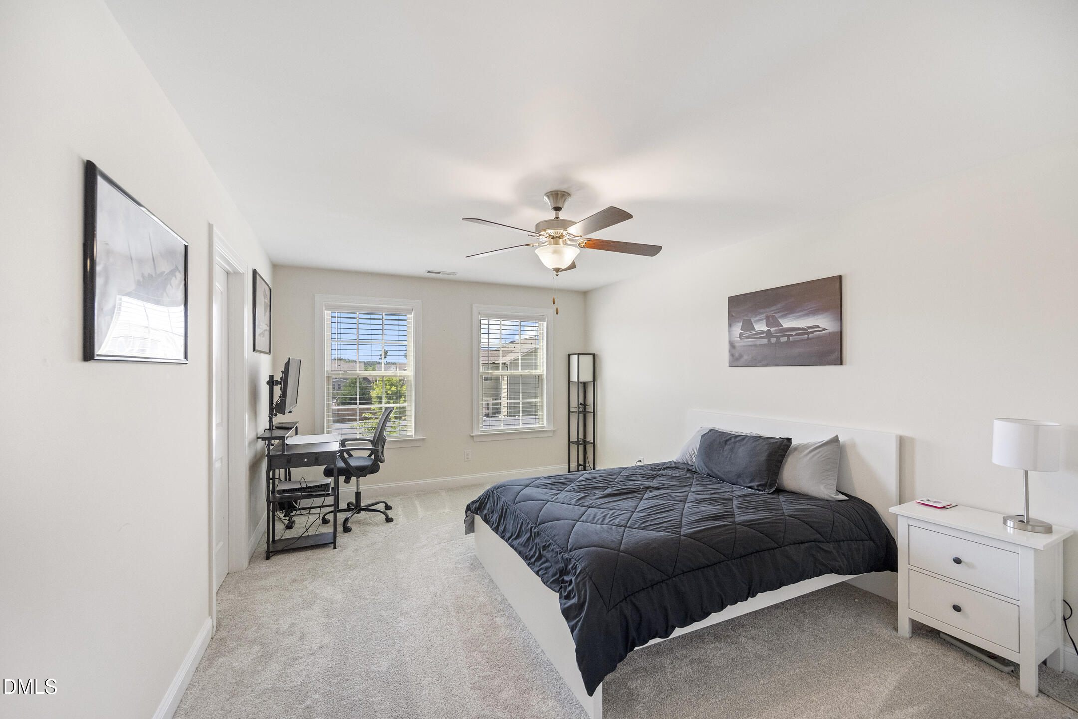 3541 Fairstone Road Wake Forest, NC 27587 - Photo 24 of 39 a bedroom with a large bed and a chandelier