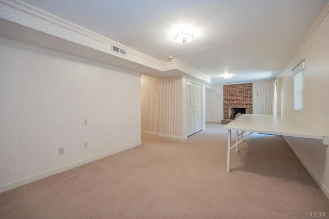 a view of a room with gym equipment and a window