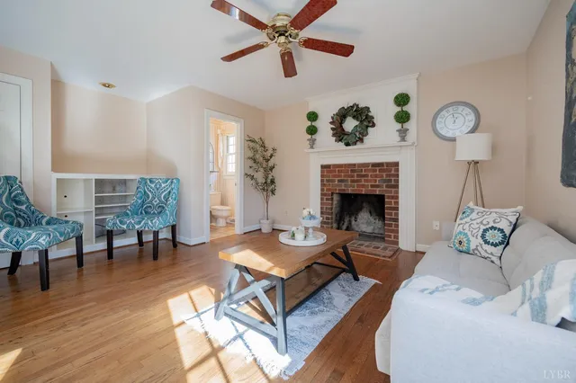 a living room with furniture and a fireplace