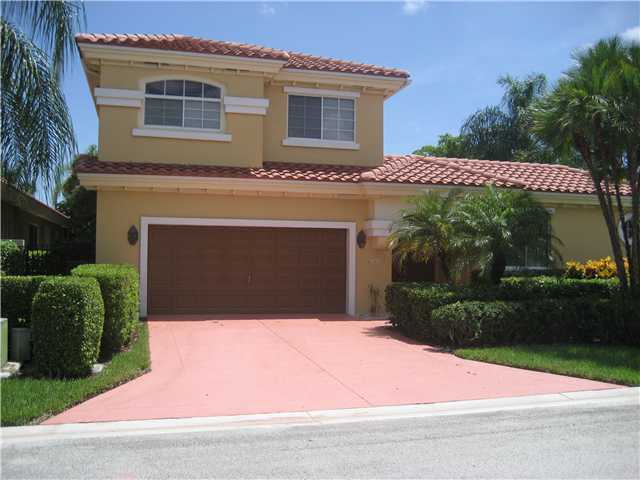 20694 Northwest 27th Terrace Boca Raton, FL 33434 - Photo 1 of 25 a front view of a house with garden