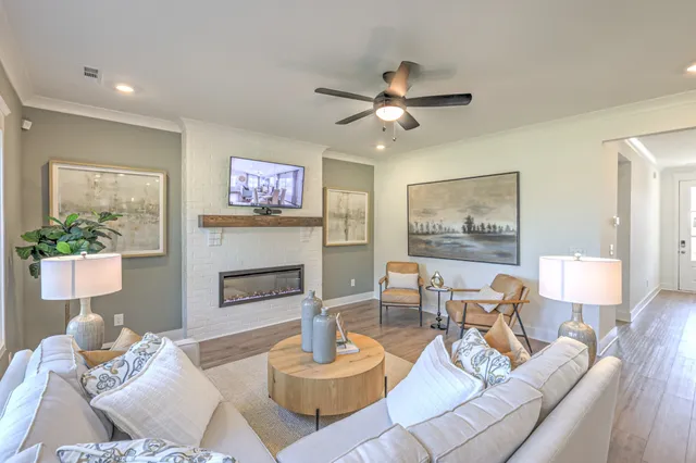 a living room with furniture and a fireplace