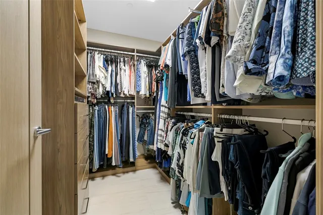 a view of swimming pool with sitting area and lake view