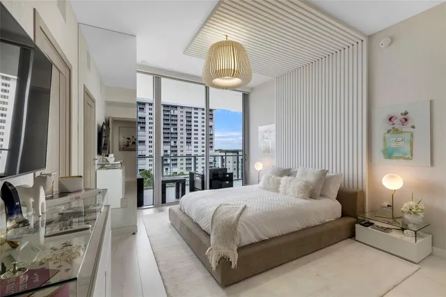 an empty room with furniture and a window