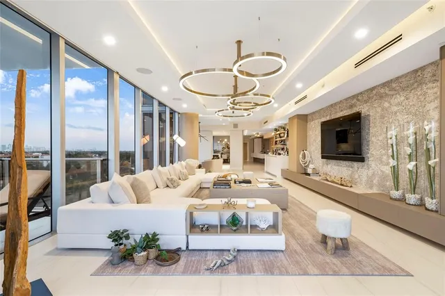 a kitchen with a sink stainless steel appliances and cabinets