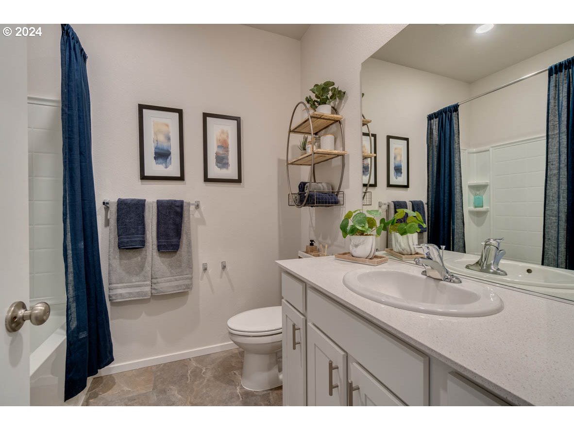 2957 V Street Springfield, OR 97477 - Photo 6 of 24 a bathroom with a sink toilet and shower