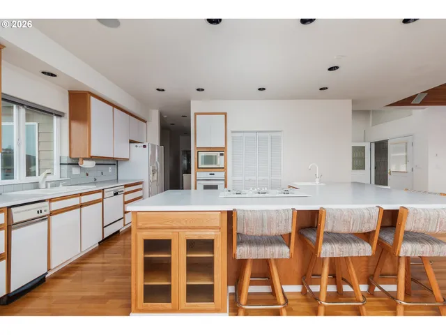 a view of an entryway with wooden floor