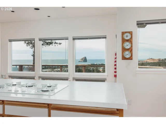 a bedroom with a bed a window and dresser