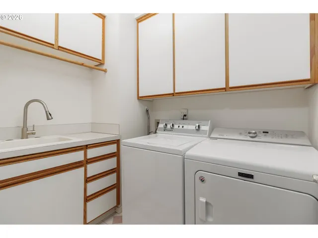 a bathroom with a granite countertop sink toilet a mirror and shower