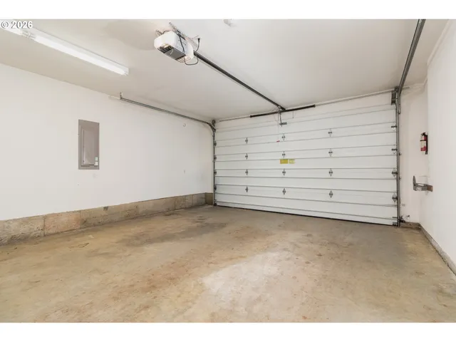 a view of an empty room with a cabinet