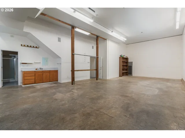 a view of an empty room with shelves