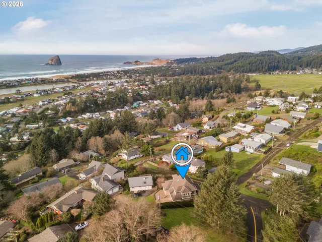 a view of a town with mountains in the background