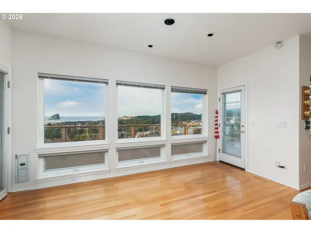 a kitchen with stainless steel appliances granite countertop a stove and white cabinets