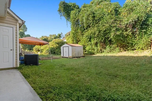 a backyard of a house with lots of green space