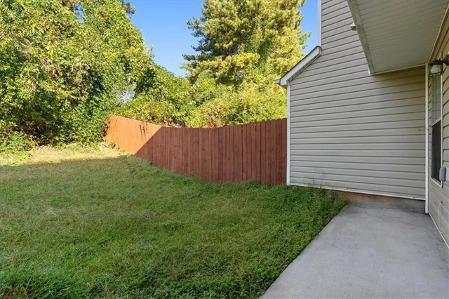 a backyard of a house with lots of green space