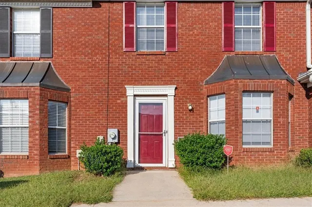 a front view of a house having yard