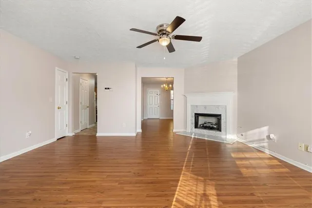 a view of an empty room and fire place