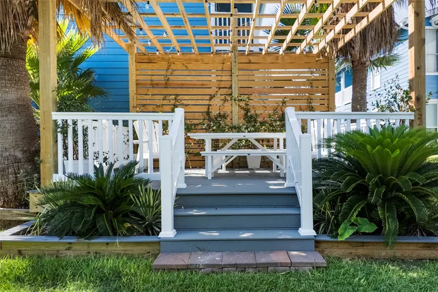 a view of front door and potted plants