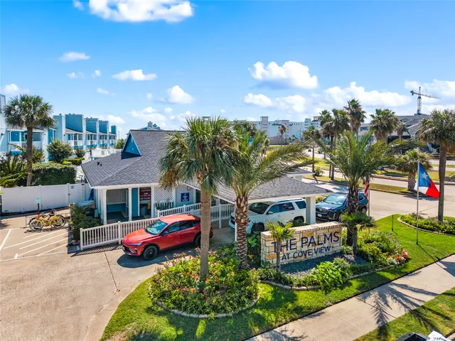 a couple of cars parked in front of house
