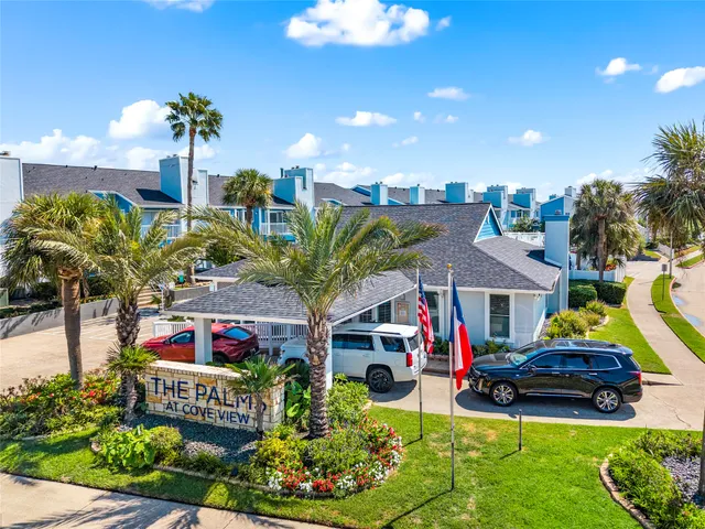 a view of a house with swimming pool and porch
