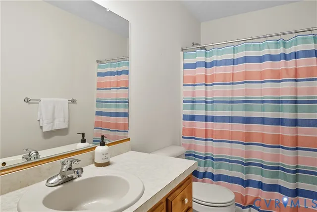 a front view of a house with a garden and porch