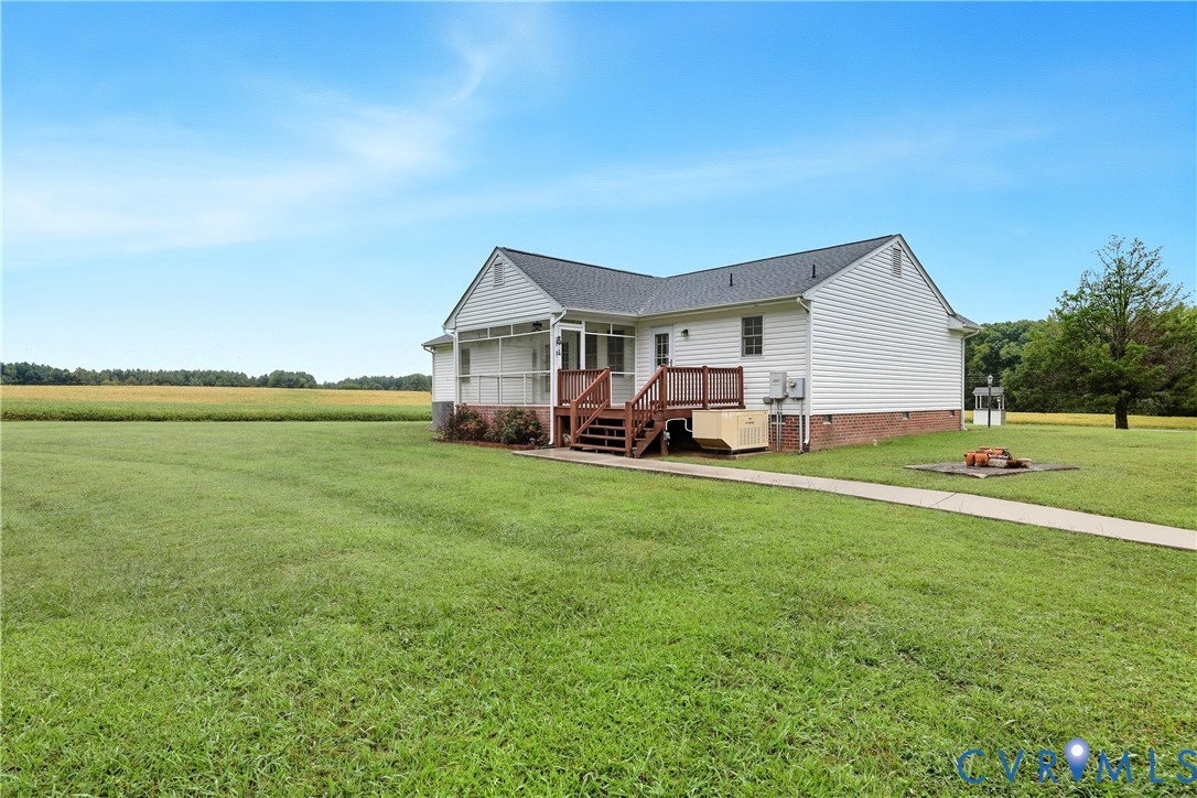 22419 Shippings Road McKenney, VA 23872 - Photo 24 of 35 a front view of a house with a garden and lake view
