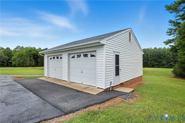 a view of a deck and yard with green space