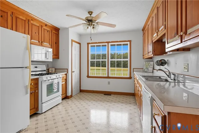 a kitchen with a sink stove and refrigerator