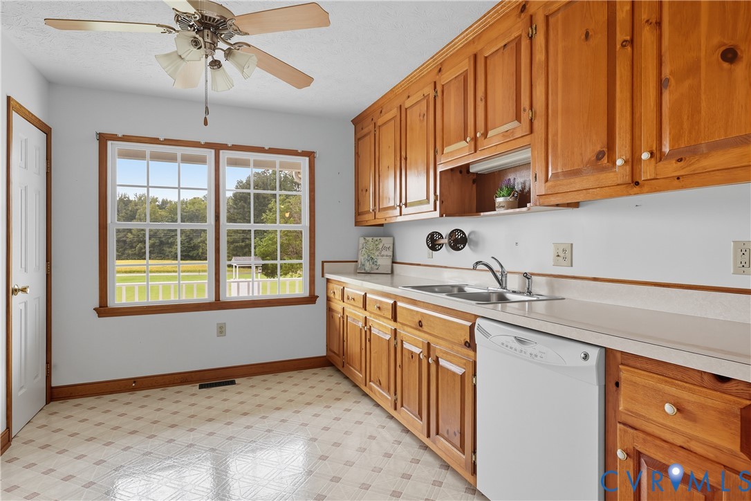 22419 Shippings Road McKenney, VA 23872 - Photo 7 of 35 a kitchen with stainless steel appliances granite countertop a sink and cabinets