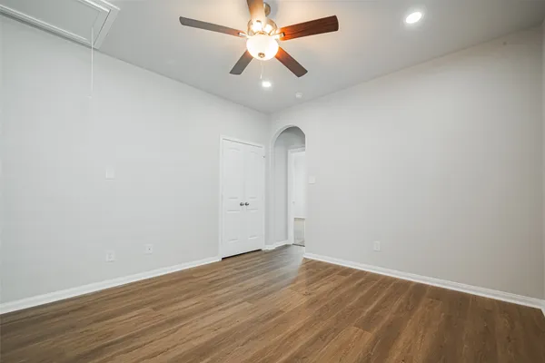 a view of room with window and ceiling fan