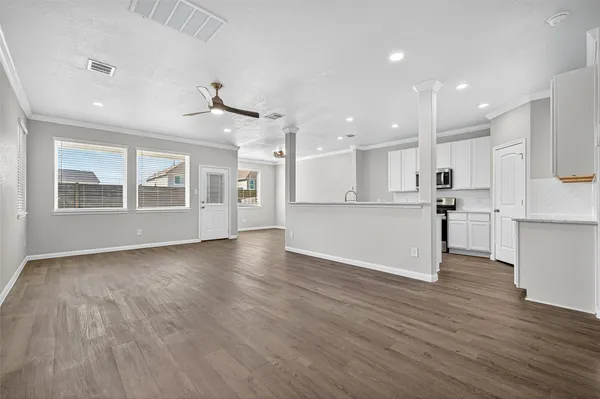 a kitchen with stainless steel appliances granite countertop a sink stove and microwave