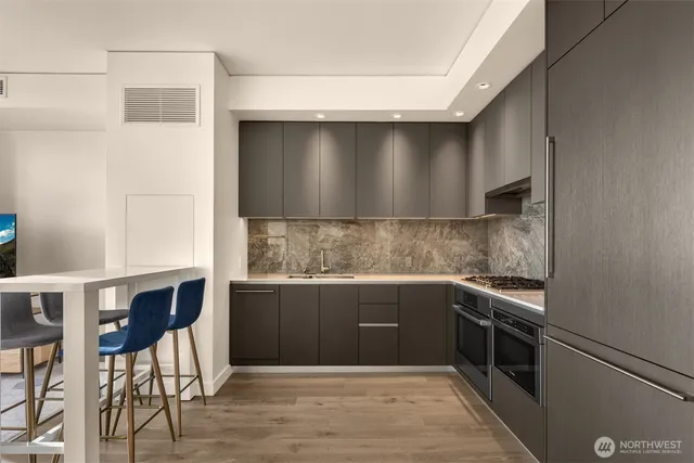 a kitchen with a sink and cabinets