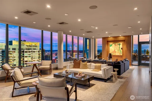 a lobby with furniture and floor to ceiling window