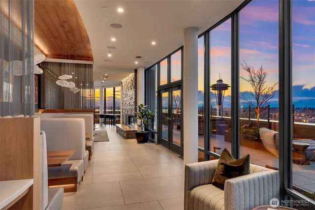 a view of a dining room with furniture and floor to ceiling window