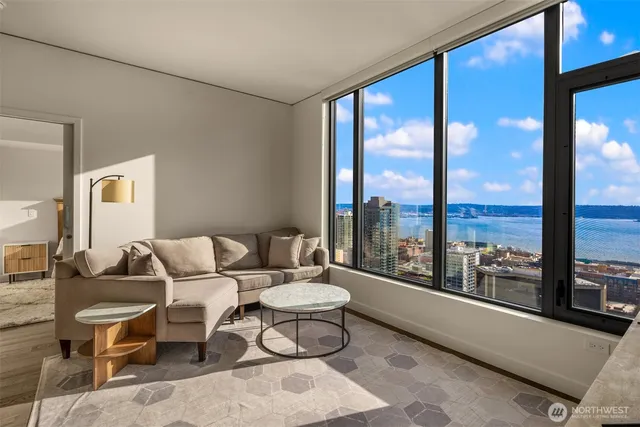 a living room with furniture and a large window