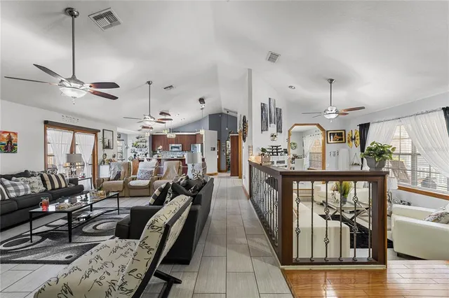 a kitchen with stainless steel appliances kitchen island granite countertop a sink dishwasher stove and oven