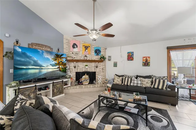 a kitchen with stainless steel appliances granite countertop a refrigerator stove and sink
