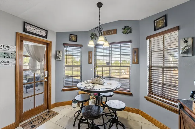 a view of a hallway with living room and a view of bedroom