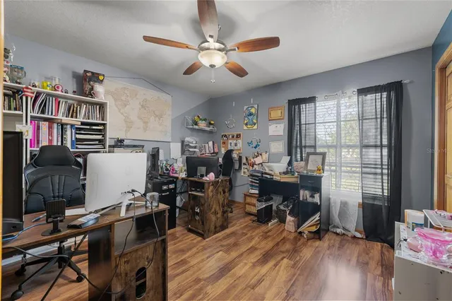 a kitchen with a sink dishwasher stove and white cabinets